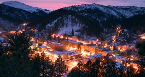 A snowy overview of Deadwood at sunset