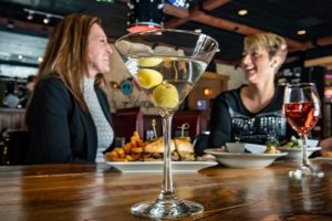 Women drinking cocktails at Deadwood Mt Grand