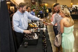 Couple in line for beer tasting at the Forks, Corks and Kegs event in Deadwood