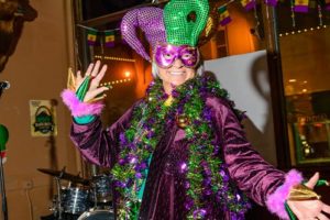 Woman dressed up for Mardi Gras event in Deadwood