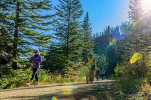 Adults walking and riding bikes on Mickelson Trail