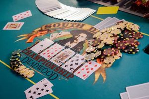 Poker table with chips and deck of cards at Silverado Franklin.