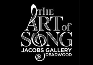 Logo for Art of Song event at Jacob's Gallery, Deadwood. Black background with white text. The letters A and O form a stylized treble clef.